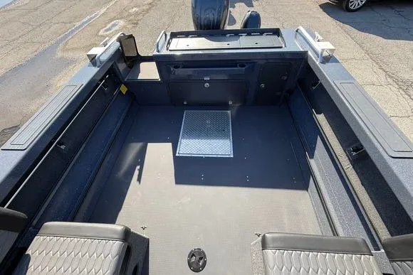 Slide: The Image of 2025 Weldcraft 210 Revolution boat interior with spacious seating and storage compartments. - 16