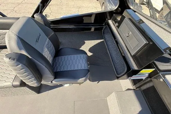Slide: The Image of Interior of 2025 Weldcraft 210 Revolution boat with stylish seating and storage compartment. - 24