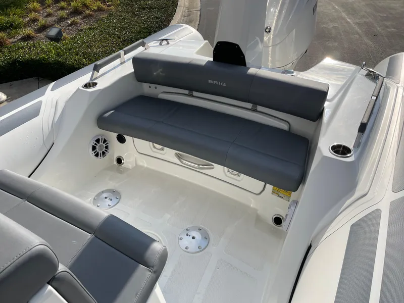 Slide: The Image of 2025 Brig Eagle 8 boat interior with gray seating and modern design. - 10