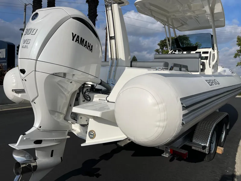 Slide: The Image of 2025 Brig Eagle 8 boat with Yamaha outboard motor on a trailer. - 3