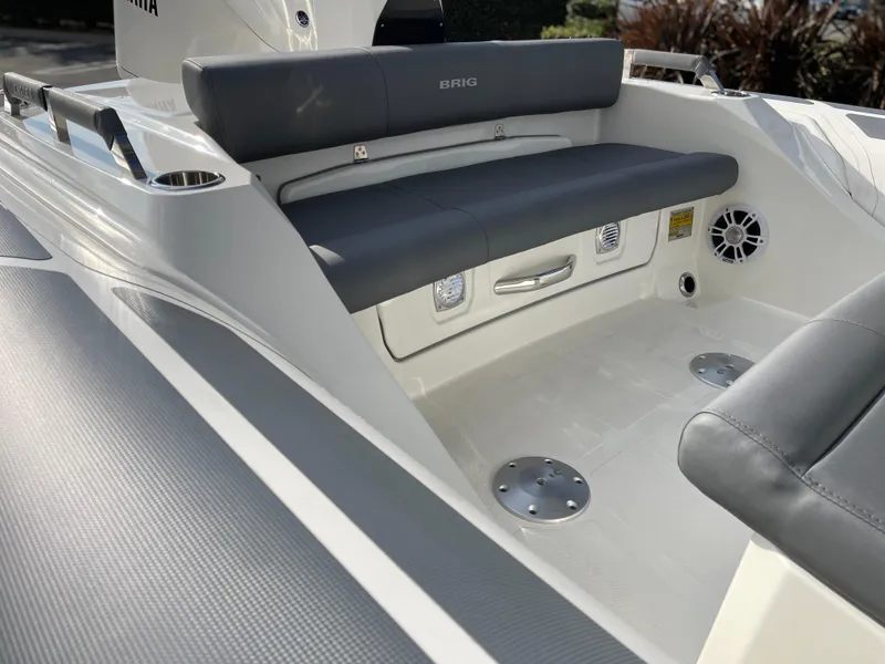 Slide: The Image of 2025 Brig Eagle 8 boat interior with gray seating and modern design. - 5