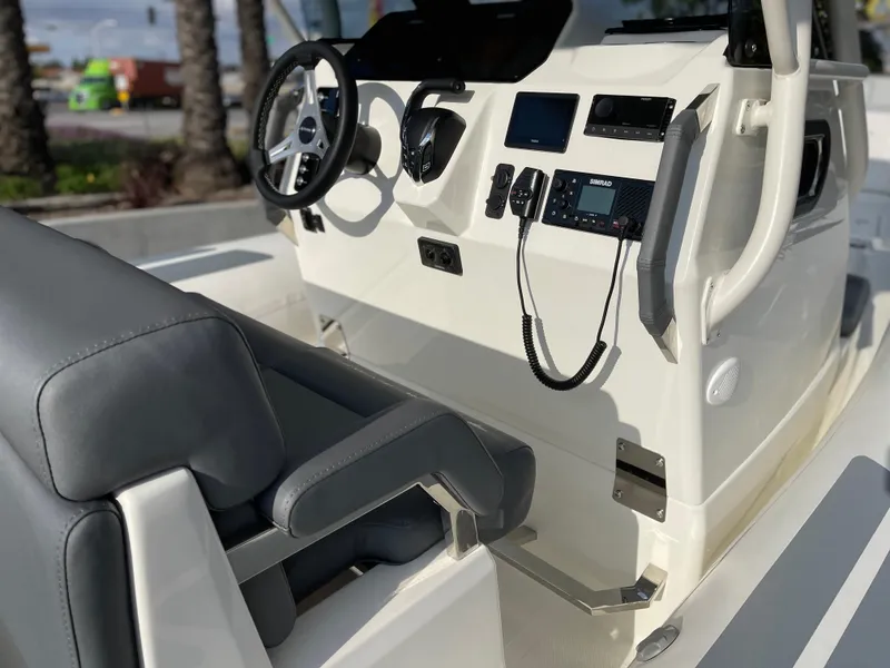 Slide: The Image of 2025 Brig Eagle 8 boat cockpit with modern steering and controls. - 6