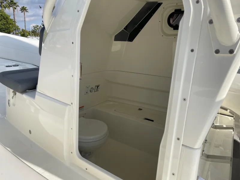 Slide: The Image of 2025 Brig Eagle 8 boat interior with compact bathroom and sleek design. - 8