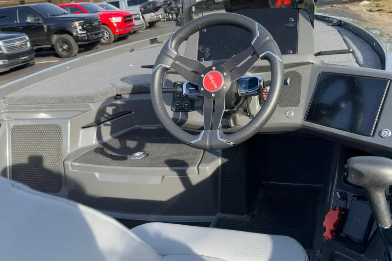 Slide: The Image of 2024 iKon LX20 boat interior with steering wheel and dashboard display. - 12