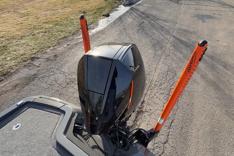 Slide: The Image of 2024 iKon LX20 boat engine with orange stabilizers on a cracked pavement. - 14