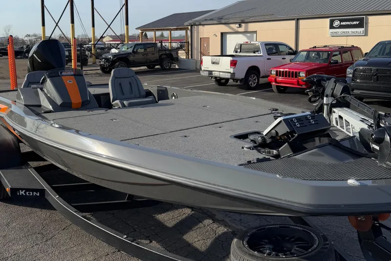 Slide: The Image of 2024 iKon LX20 boat in a parking lot, showcasing sleek design and modern features. - 6