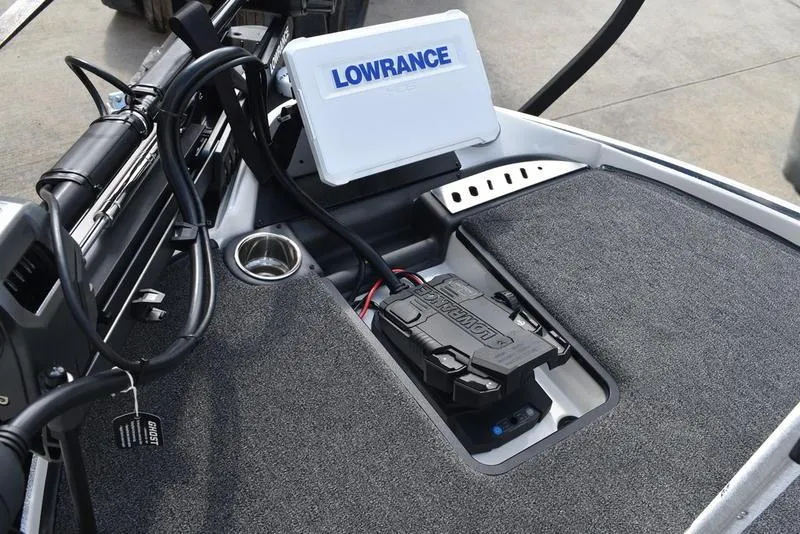 Slide: The Image of 2025 Triton 19 TrX Patriot boat dashboard with Lowrance electronics and control panel. - 10