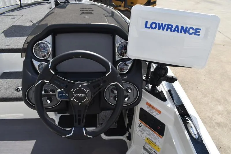 Slide: The Image of Steering console of 2025 Triton 19 TrX Patriot with Lowrance display. - 17