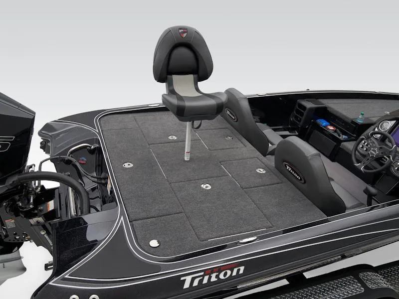 Slide: The Image of 2025 Triton 19 TrX Patriot boat interior with seating and control panel. - 23