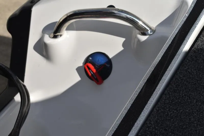 Slide: The Image of 2025 Triton 19 TrX Patriot boat detail with handle and control knob. - 30