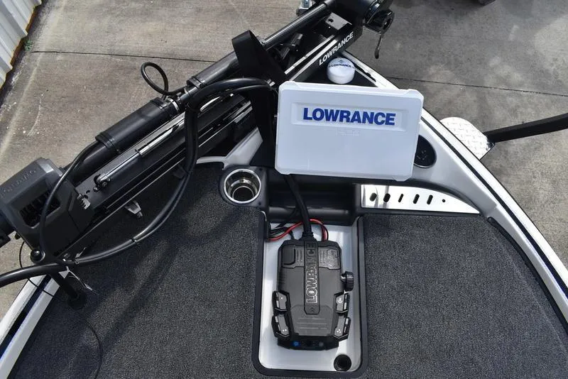 Slide: The Image of 2025 Triton 19 TrX Patriot boat with Lowrance electronics on deck. - 8