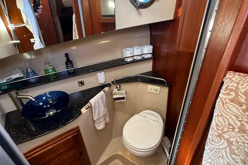 Slide: The Image of Luxurious bathroom in 2014 Ranger Tugs R-31CB with modern sink and toilet. - 26