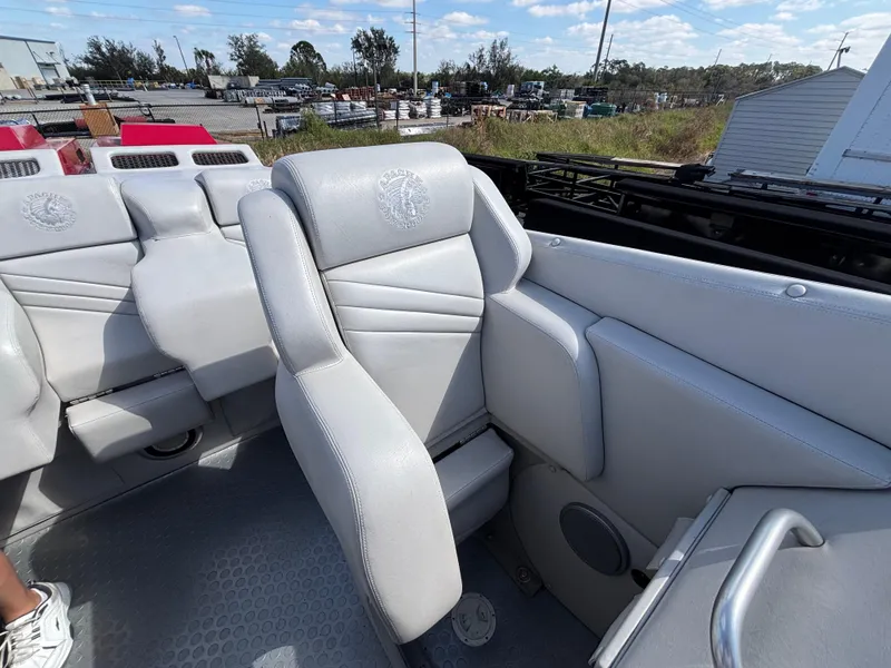 Slide: The Image of Interior of a 1994 Apache 47 Fire Water boat with gray leather seats. - 14
