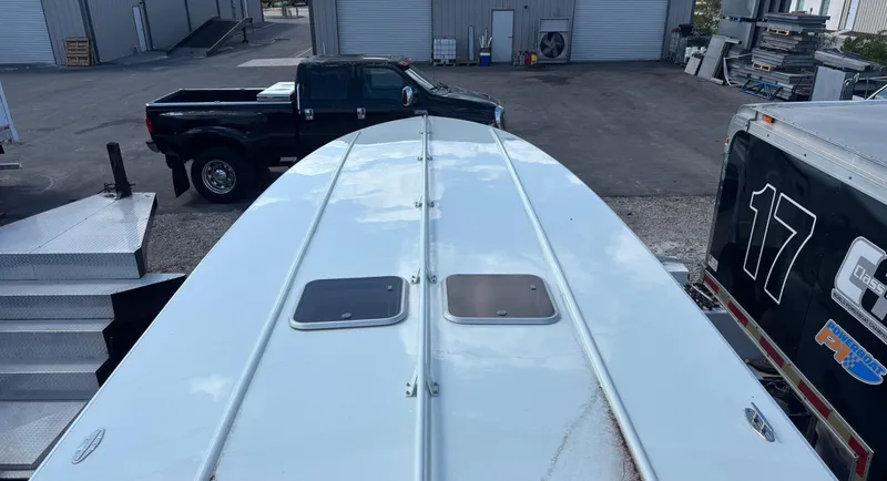 Slide: The Image of Top view of a 1994 Apache 47 Fire Water boat in an industrial area. - 16