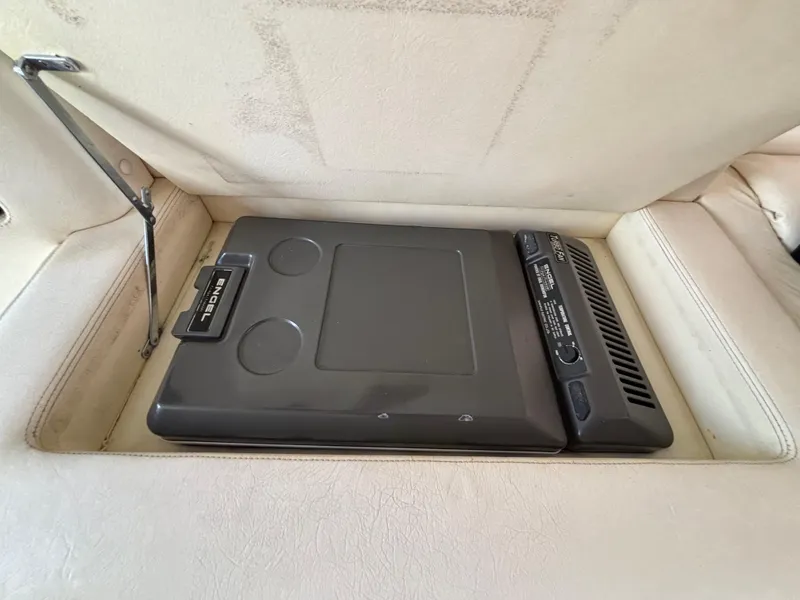 Slide: The Image of Built-in cooler in 1994 Apache 47 Fire Water boat interior compartment. - 21