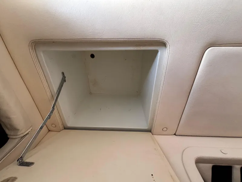 Slide: The Image of Interior compartment of a 1994 Apache 47 Fire Water boat, featuring a storage area. - 22