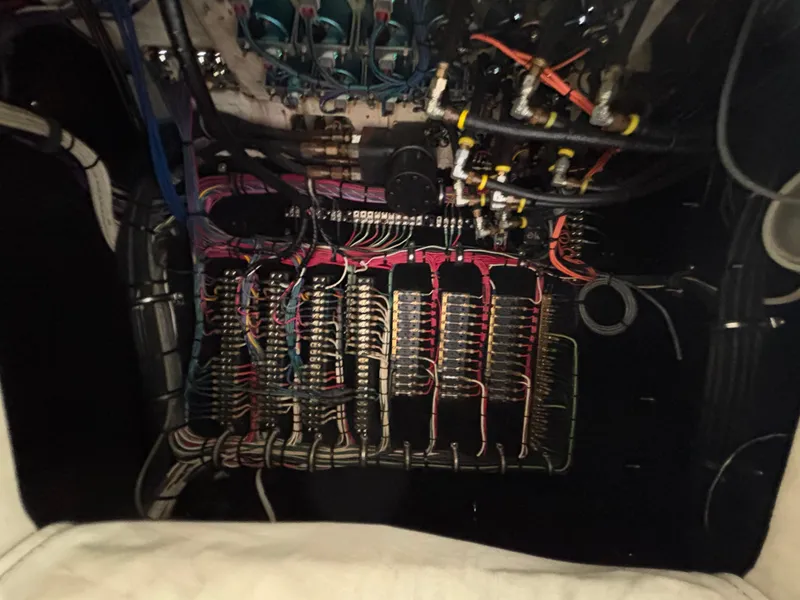 Slide: The Image of Wiring system inside a 1994 Apache 47 Fire Water boat, showcasing complex electrical connections. - 25