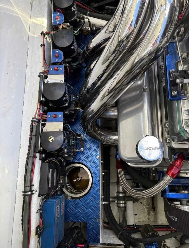 Slide: The Image of Engine compartment of a 1994 Apache 47 Fire Water boat with chrome components. - 4