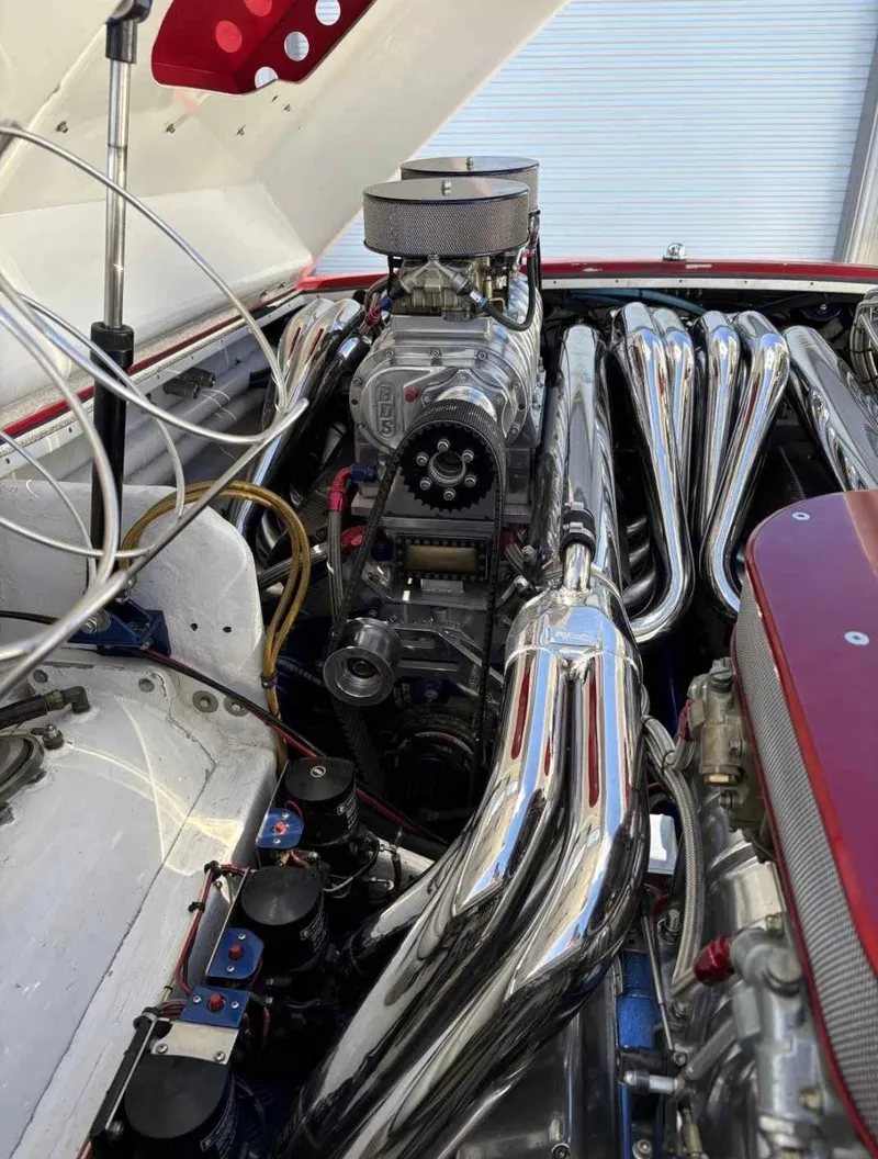 Slide: The Image of 1994 Apache 47 Fire Water engine with chrome headers and supercharger. - 5