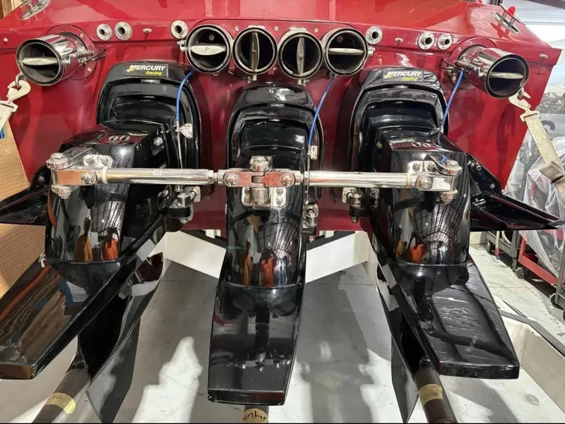 Slide: The Image of Triple Mercury engines on a 1994 Apache 47 Fire Water boat, rear view. - 8