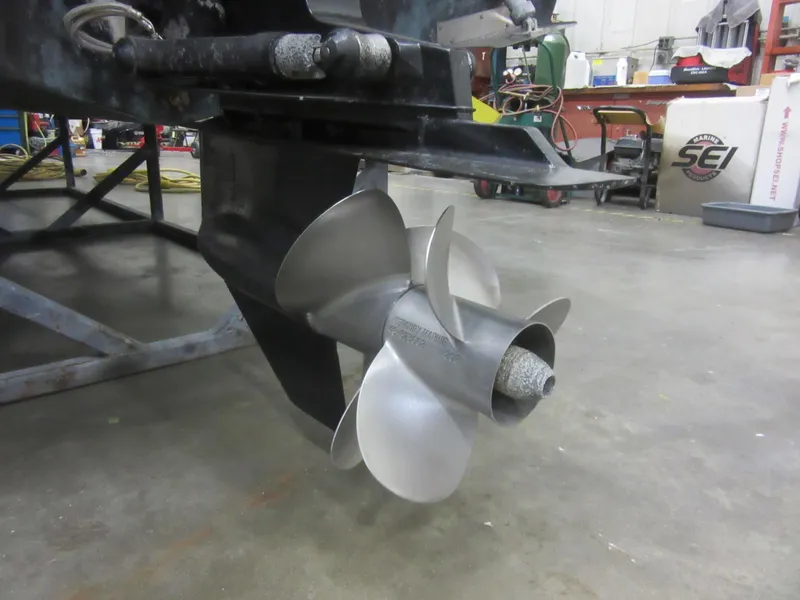 Slide: The Image of 2004 Bayliner 245 boat propeller in a workshop setting. - 4