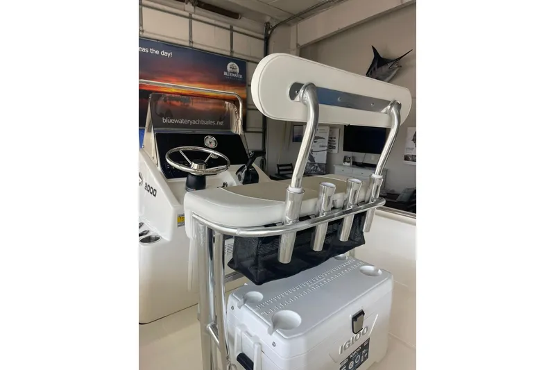 Slide: The Image of 2025 Bulls Bay 2000 boat interior with steering wheel and rod holders. - 4