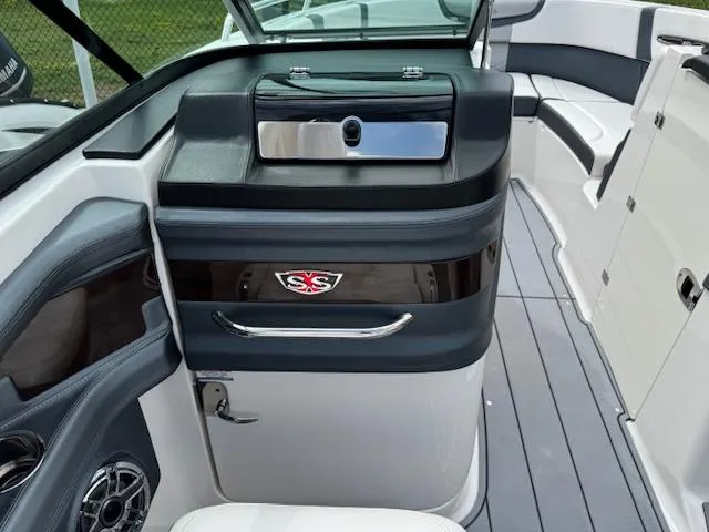 Slide: The Image of 2021 Chaparral 267 SSX OB boat interior with sleek seating and modern design. - 13