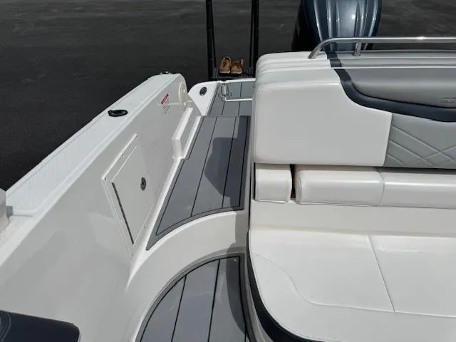 Slide: The Image of 2021 Chaparral 267 SSX OB boat interior with sleek seating and modern design. - 19