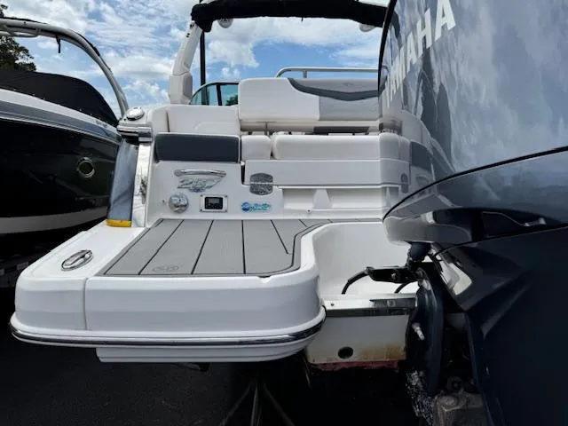 Slide: The Image of 2021 Chaparral 267 SSX OB boat with Yamaha outboard motor, rear view. - 24