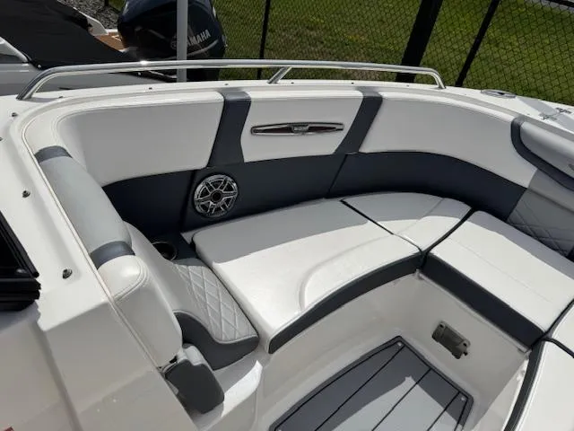 Slide: The Image of 2021 Chaparral 267 SSX OB boat interior with white and gray seating. - 7
