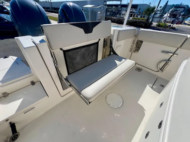 Slide: The Image of 2023 Sailfish 272 CC boat interior with foldable seating and modern design. - 16