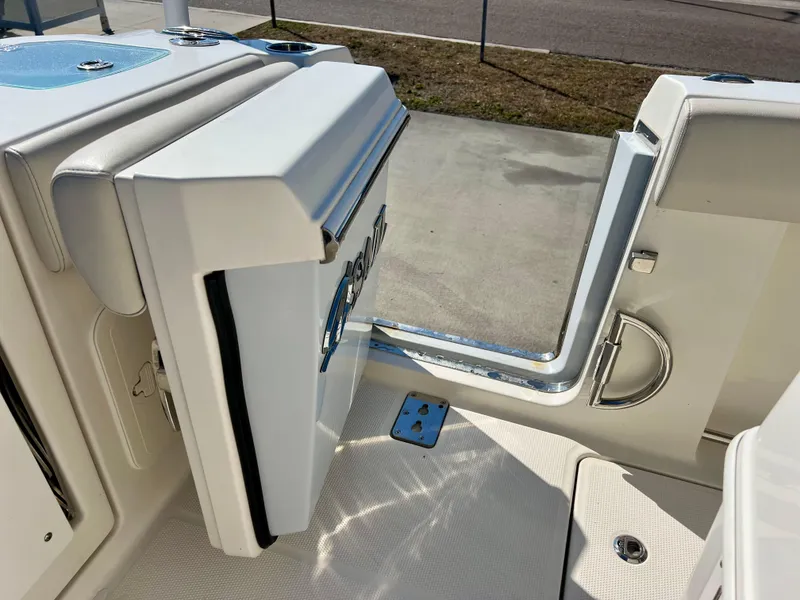 Slide: The Image of 2023 Sailfish 272 CC boat with open side door and sleek interior design. - 18
