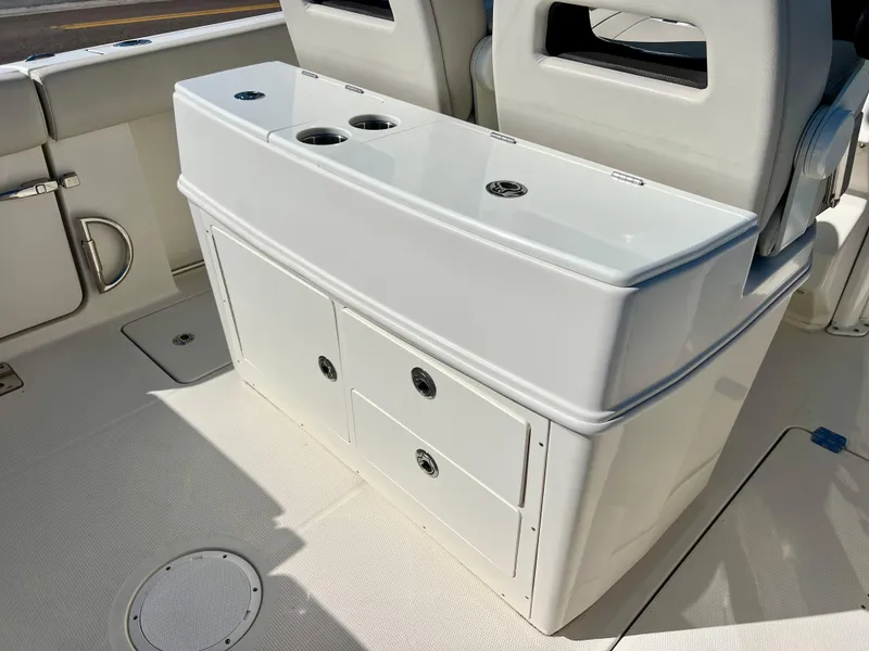 Slide: The Image of 2023 Sailfish 272 CC boat interior with storage compartments and seating. - 21