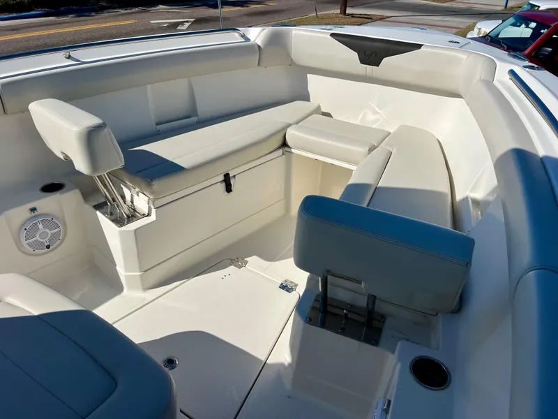 Slide: The Image of 2023 Sailfish 272 CC boat interior with cushioned seating and storage compartments. - 28