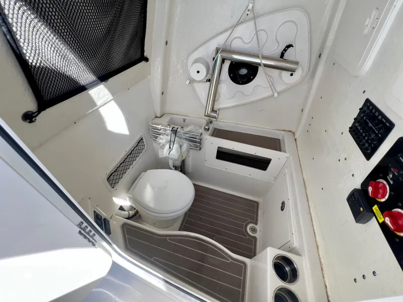 Slide: The Image of 2023 Sailfish 272 CC boat interior with compact bathroom and modern amenities. - 33