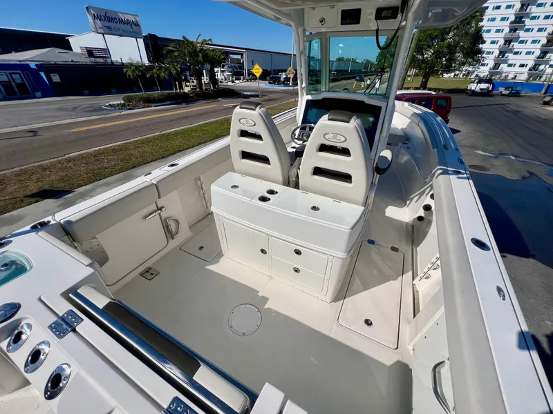 Slide: The Image of 2023 Sailfish 272 CC boat interior with dual seats and storage compartments. - 36