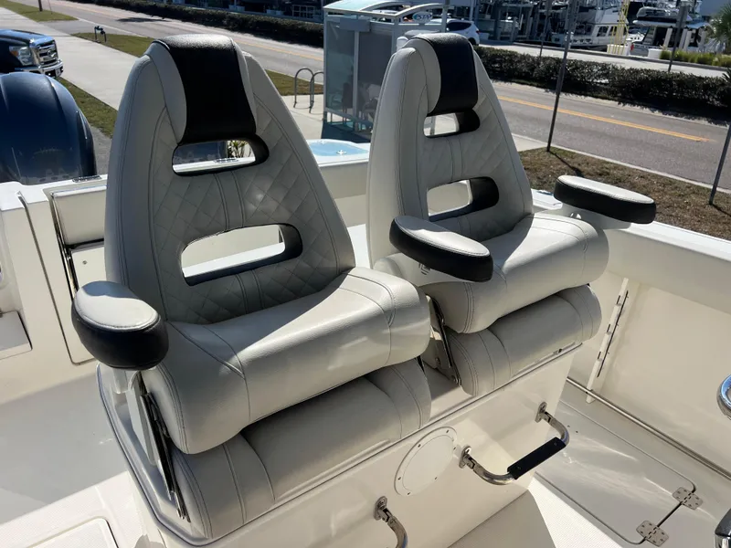 Slide: The Image of 2023 Sailfish 272 CC boat seats with armrests and modern design. - 8