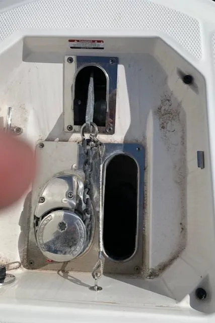 Slide: The Image of 2019 Robalo R272 Center Console anchor locker with chain and winch system. - 10