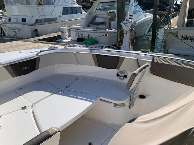 Slide: The Image of 2019 Robalo R272 Center Console boat interior at marina dock. - 11