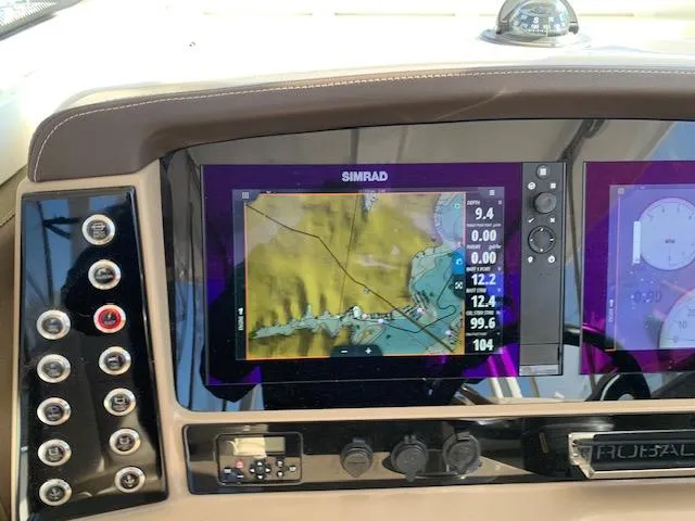 Slide: The Image of Dashboard of 2019 Robalo R272 Center Console with Simrad navigation display. - 19