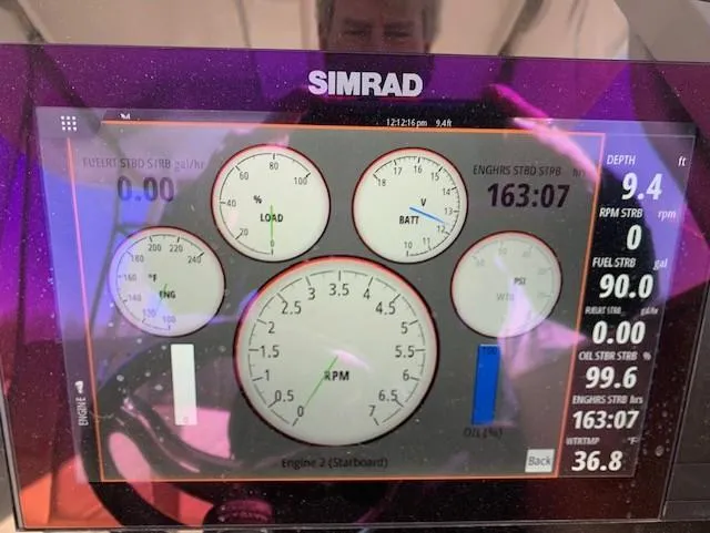 Slide: The Image of Simrad display on 2019 Robalo R272 Center Console showing engine metrics and gauges. - 20