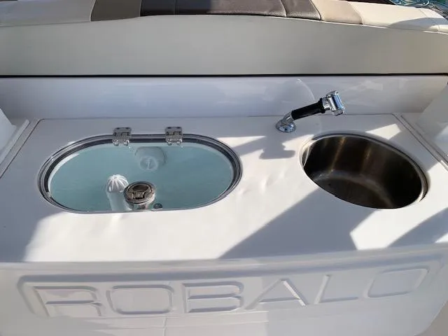 Slide: The Image of 2019 Robalo R272 Center Console boat with sink and livewell. - 28