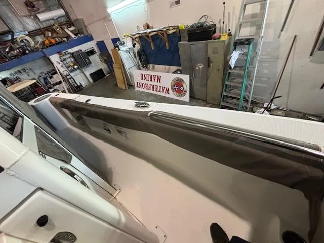 Slide: The Image of 2019 Robalo R272 Center Console boat interior in a workshop setting. - 34