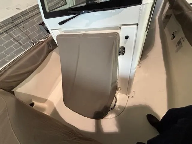 Slide: The Image of 2019 Robalo R272 Center Console interior with covered console and seating. - 37