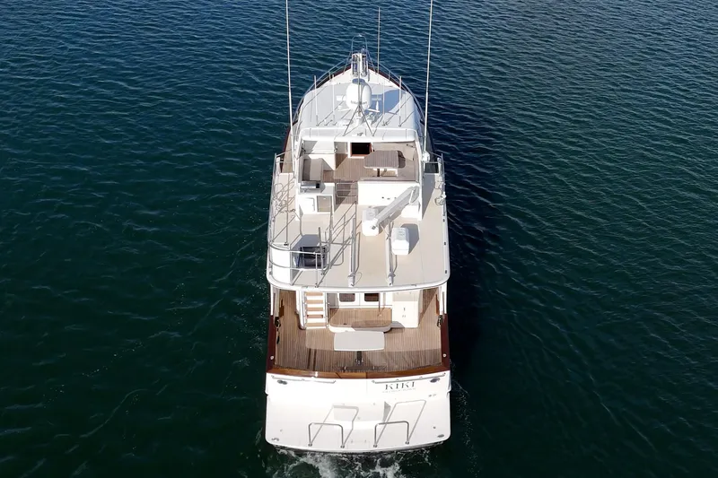 Slide: The Image of 2018 Fleming 58 Pilothouse yacht cruising on open water, aerial view. - 15