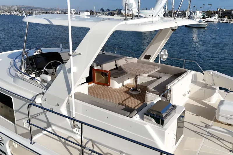Slide: The Image of Luxurious 2018 Fleming 58 Pilothouse yacht with spacious outdoor seating and ocean view. - 17