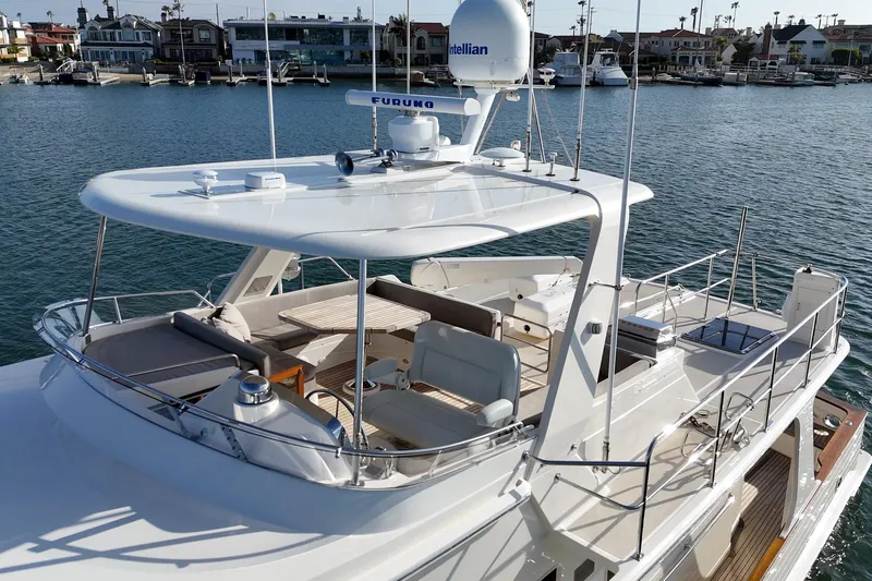 Slide: The Image of 2018 Fleming 58 Pilothouse yacht with spacious deck and modern navigation equipment. - 19