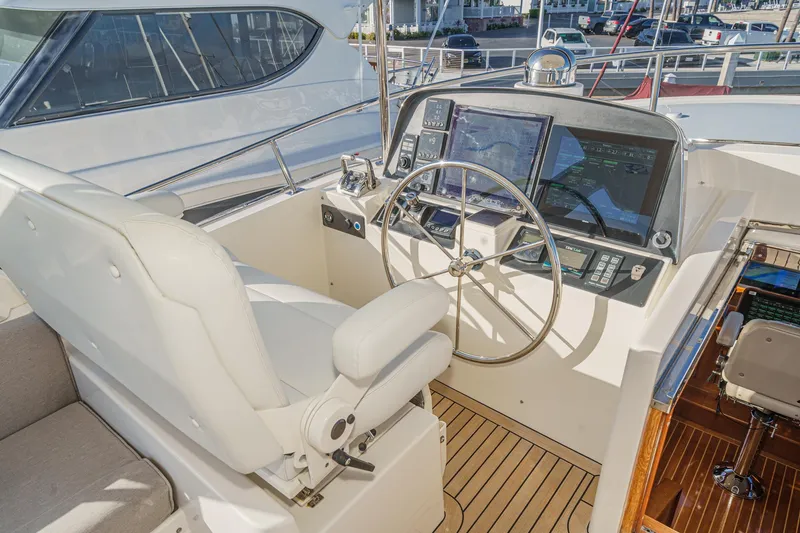 Slide: The Image of Pilothouse of 2018 Fleming 58 yacht with steering wheel and navigation controls. - 20