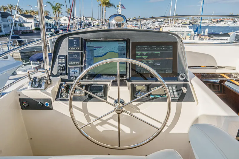 Slide: The Image of Pilothouse of 2018 Fleming 58 yacht with modern navigation equipment and steering wheel. - 22