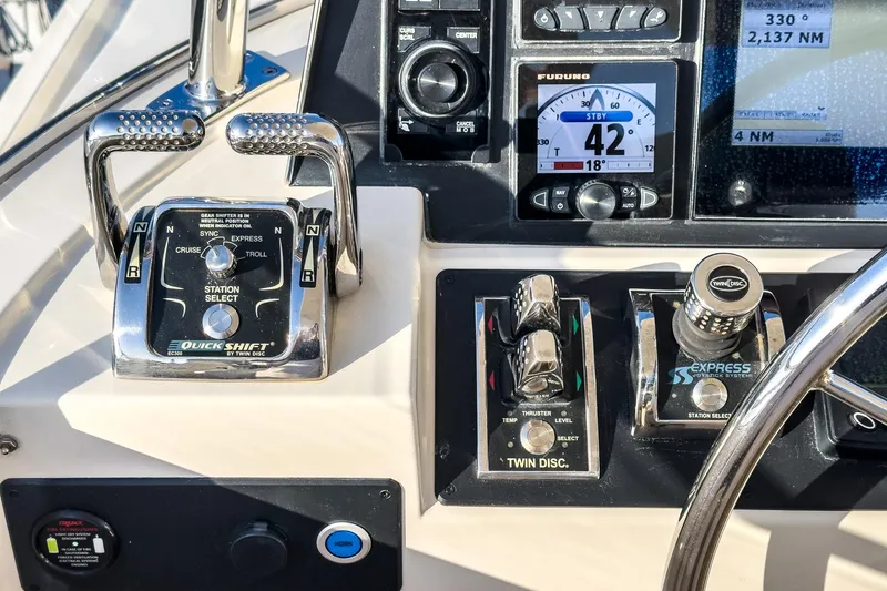 Slide: The Image of Control panel of a 2018 Fleming 58 Pilothouse yacht with navigation instruments. - 23